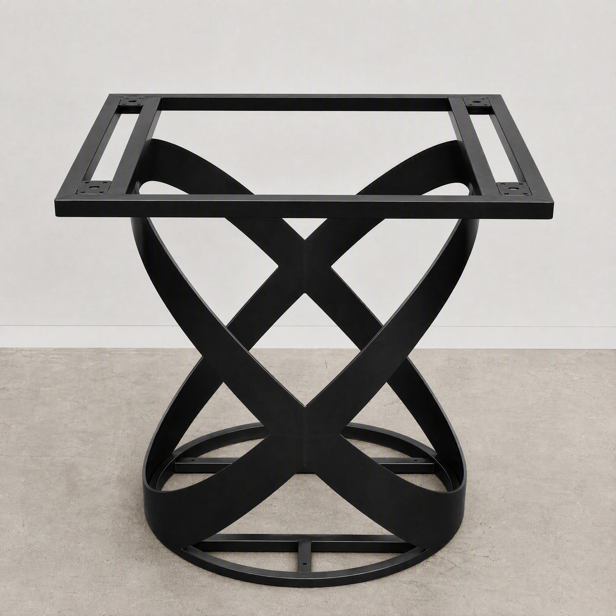 A black metal table base with a square top frame and an interlocking twisted X-shaped pedestal base, shown against a neutral studio backdrop.
