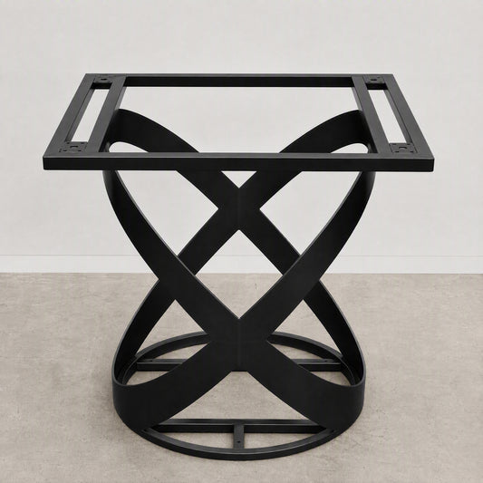 A black metal table base with a square top frame and an interlocking twisted X-shaped pedestal base, shown against a neutral studio backdrop.